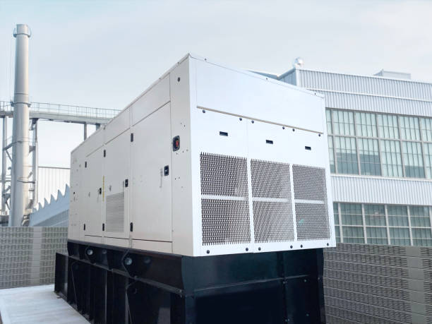 Diesel standby generator in front of a factory building
